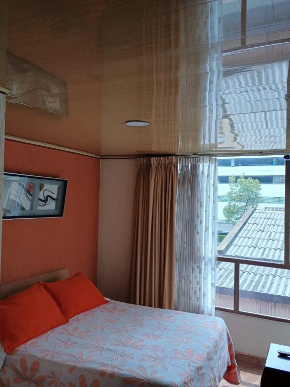 Postel nebo postele na pokoji v ubytování Hoteles Bogotá Inn Galerías