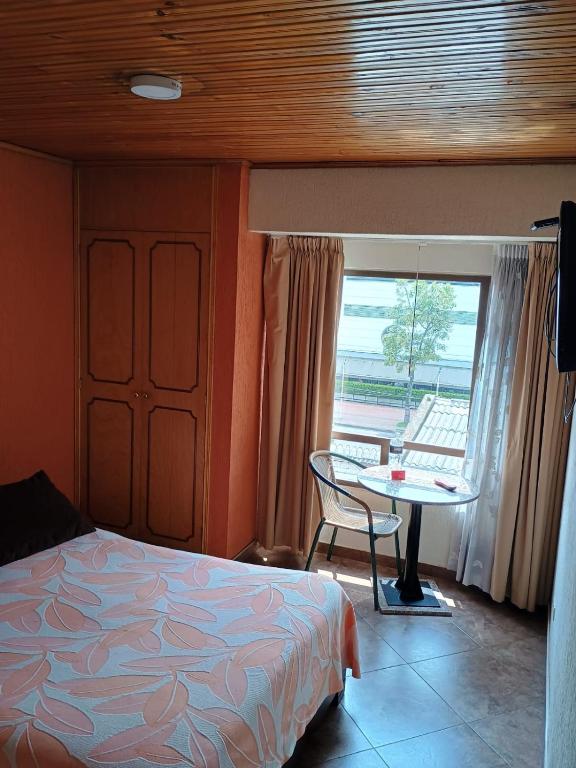 Postel nebo postele na pokoji v ubytování Hoteles Bogotá Inn Galerías