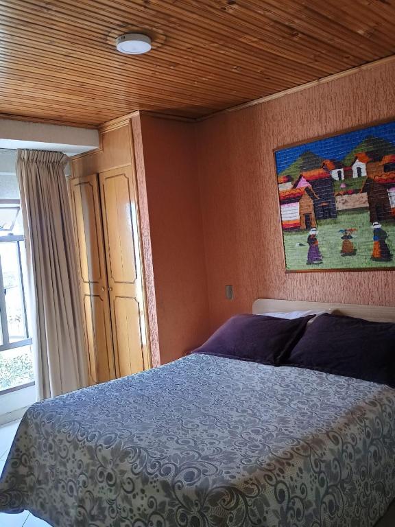 Postel nebo postele na pokoji v ubytování Hoteles Bogotá Inn Galerías