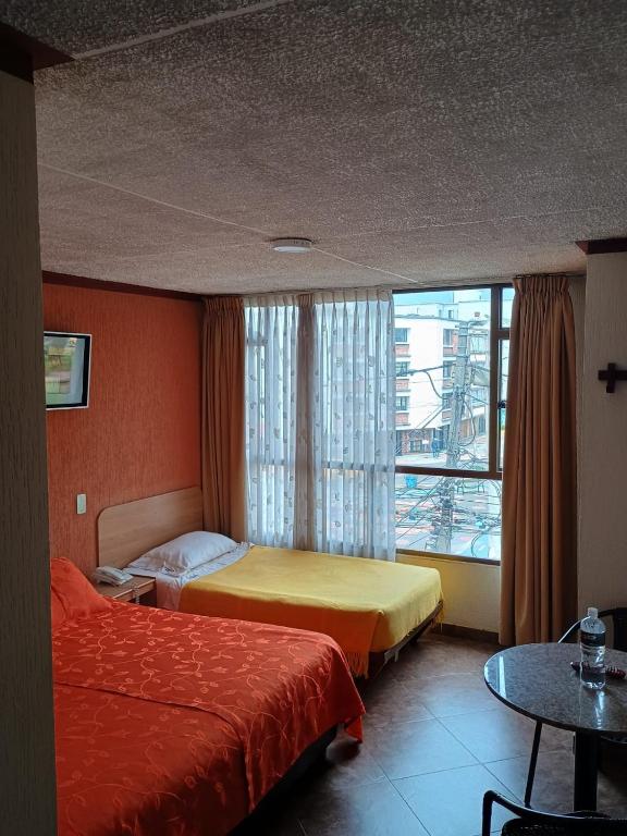 Postel nebo postele na pokoji v ubytování Hoteles Bogotá Inn Galerías