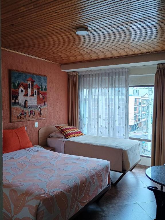 Postel nebo postele na pokoji v ubytování Hoteles Bogotá Inn Galerías