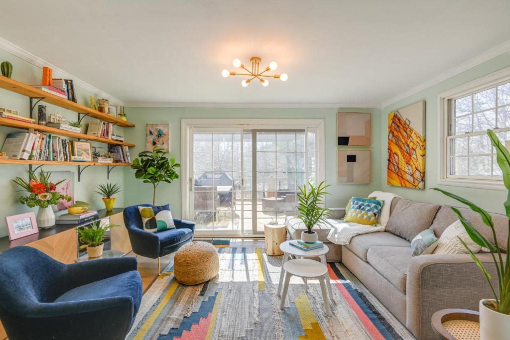 a living room with a couch and chairs at Family Home with Furnished Deck in Fairview! in Fairview