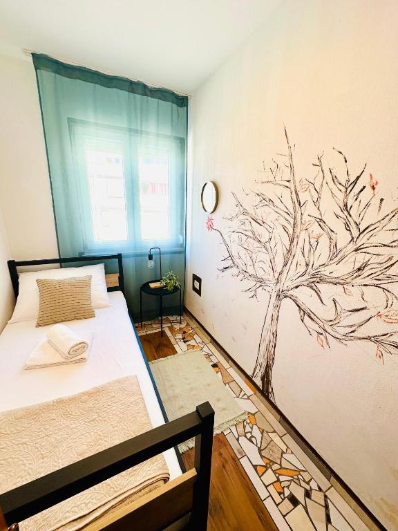 Postel nebo postele na pokoji v ubytování HOSTEL ART & JOY