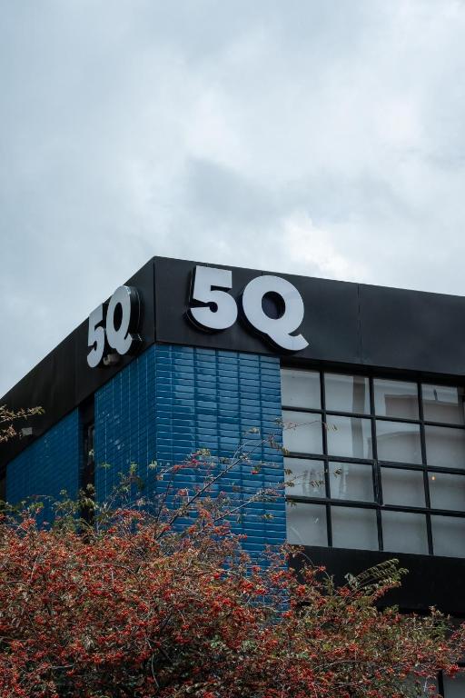 a building with the sign on top of it at 5Q HOUSE Zona G in Bogotá