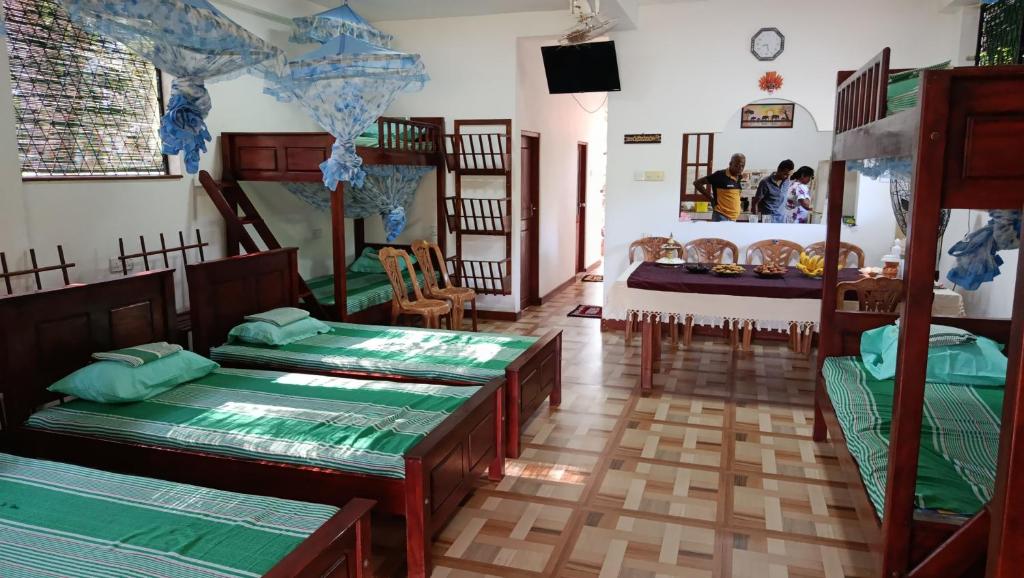 Postel nebo postele na pokoji v ubytování Sandaliaya Rest - සඳලිය රෙස්ට්