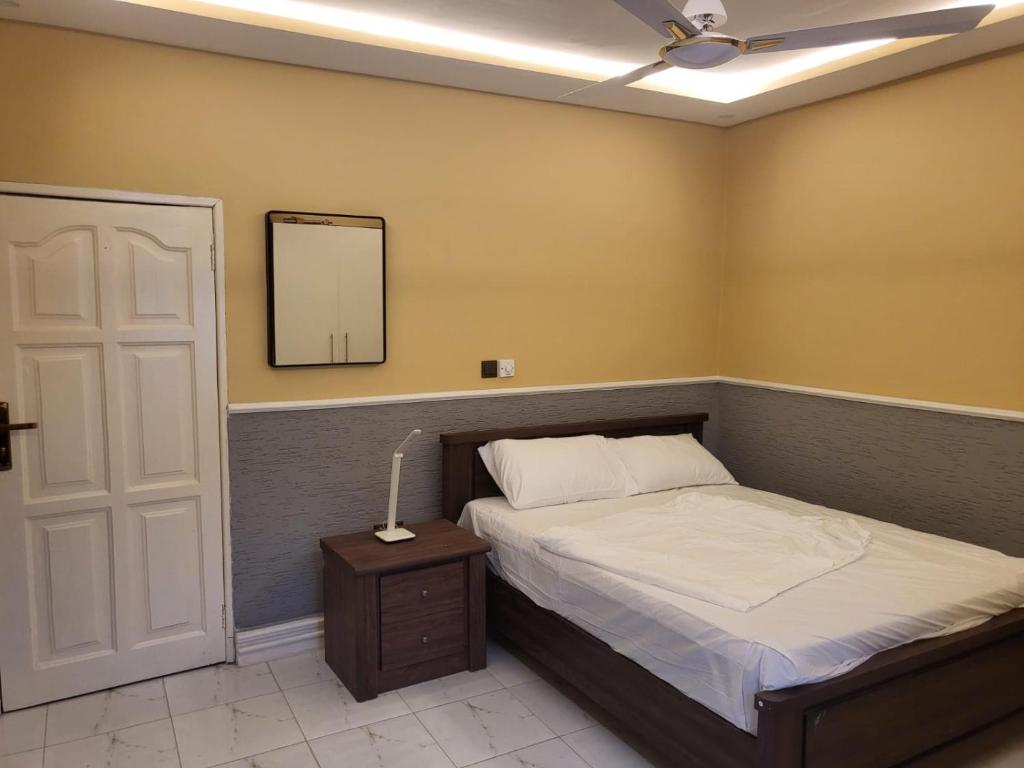 Ένα ή περισσότερα κρεβάτια σε δωμάτιο στο Ghanastays