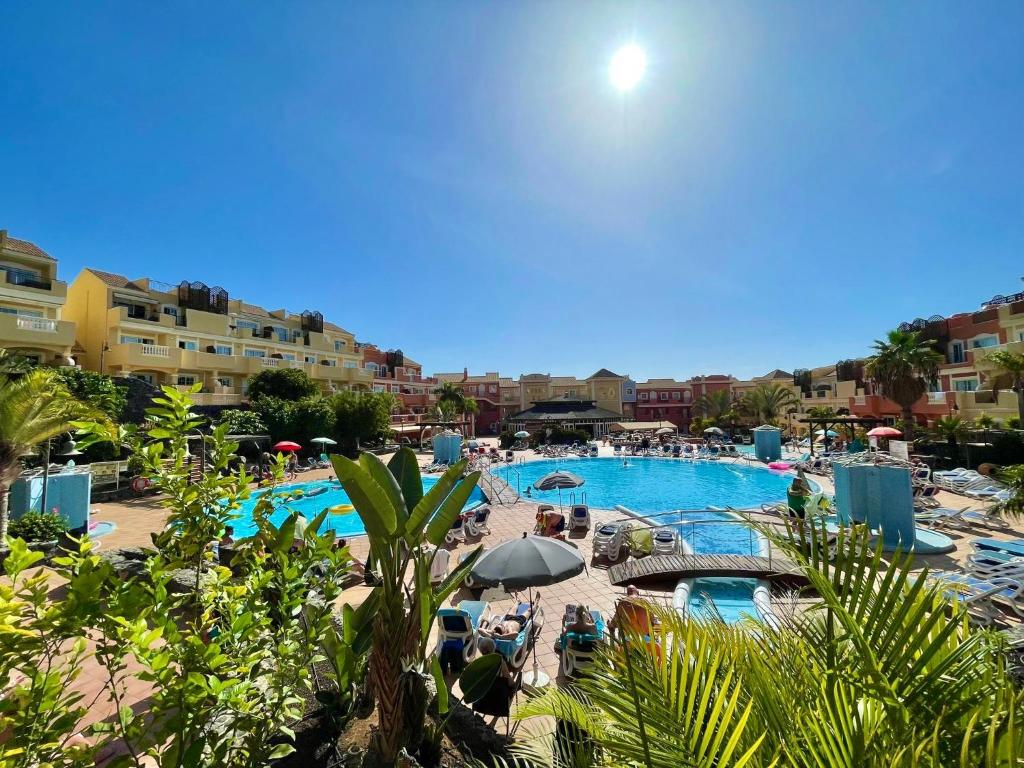 a view of a pool at a resort at Sunset Apartment 5 & Heated Pool in Los Cristianos