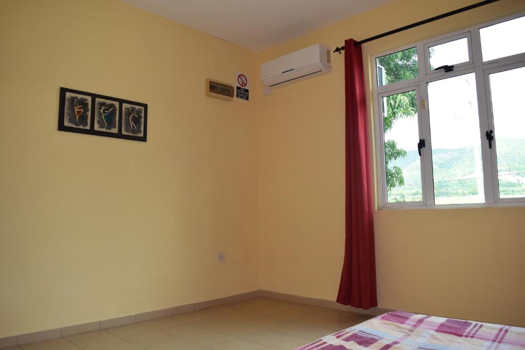 Postel nebo postele na pokoji v ubytování Baywatch Apartment