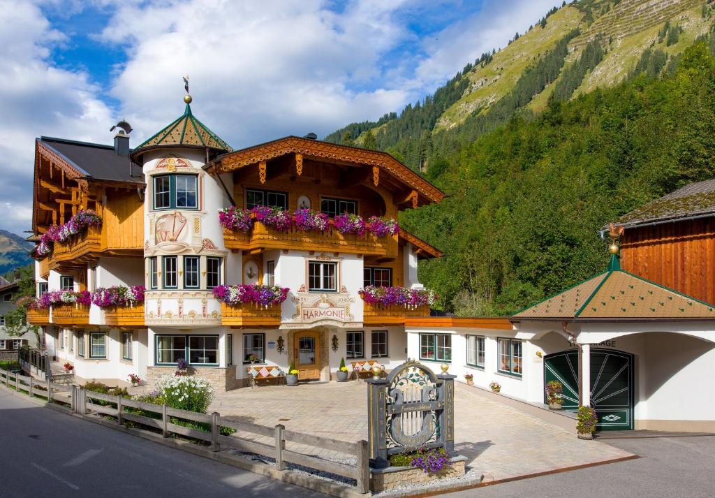 a large building with flowers in the balconies on it at Ferienschlössl Harmonie in Holzgau
