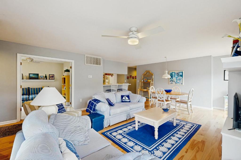 a living room with a couch and a table at Sea Colony - 55054 Pine Lake Dr in Bethany Beach