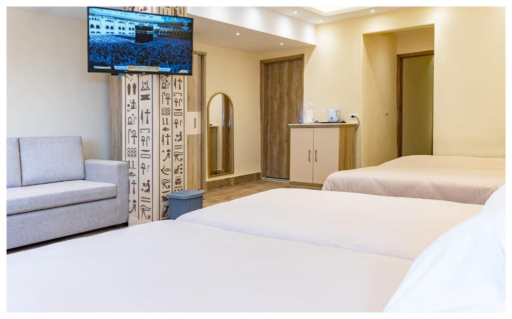 Postel nebo postele na pokoji v ubytování Hasan Pyramids Hotel