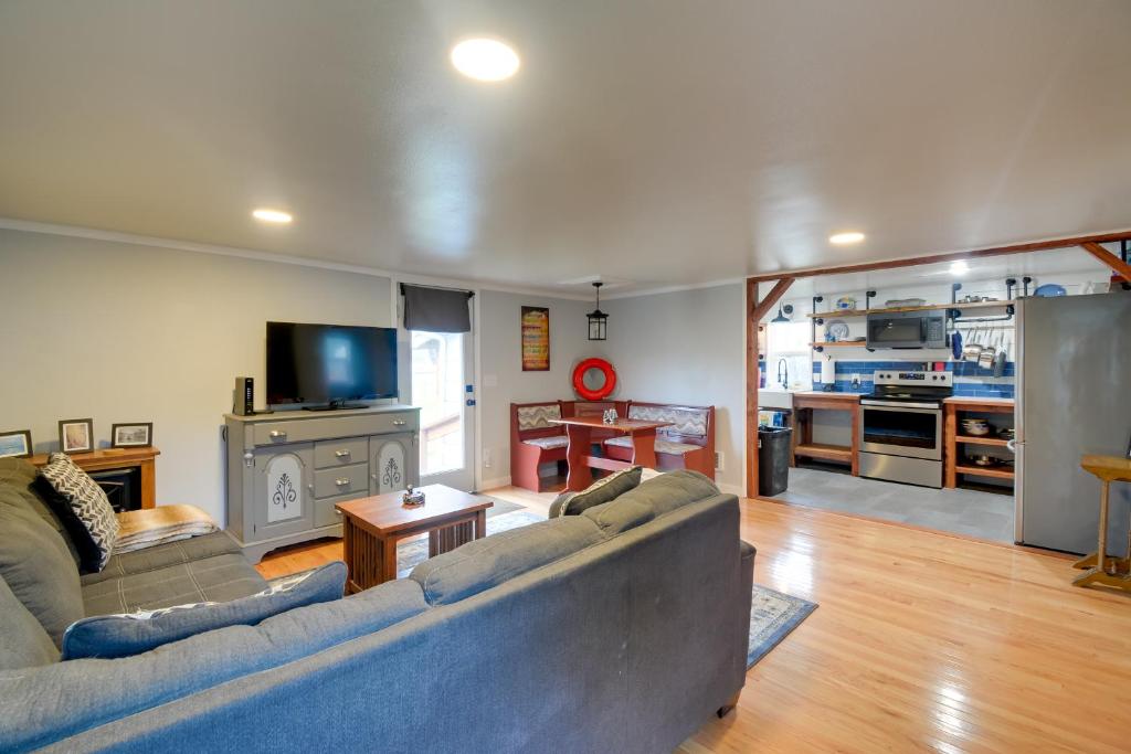 a living room with a couch and a tv at Ocean-Themed Westport Home Bike to Ocean! in Westport