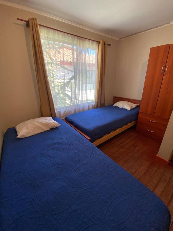 Postel nebo postele na pokoji v ubytování CASA A11 Lago Rapel