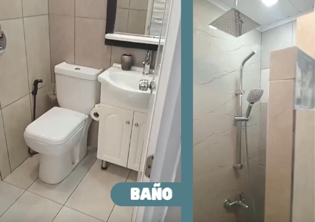 een badkamer met toilet, wastafel en douche bij Moderno apto con terraza a cuadras del Shopping Terminal in Paysandú