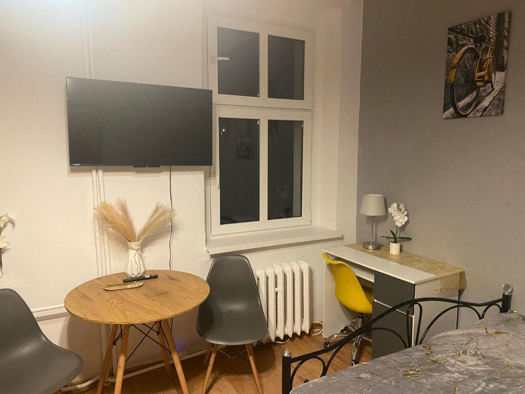 TV a/nebo společenská místnost v ubytování Magnolia Rooms Plus