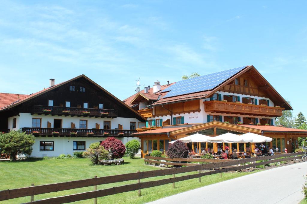a building with a solar roof on top of it at Helmerhof in Schwangau