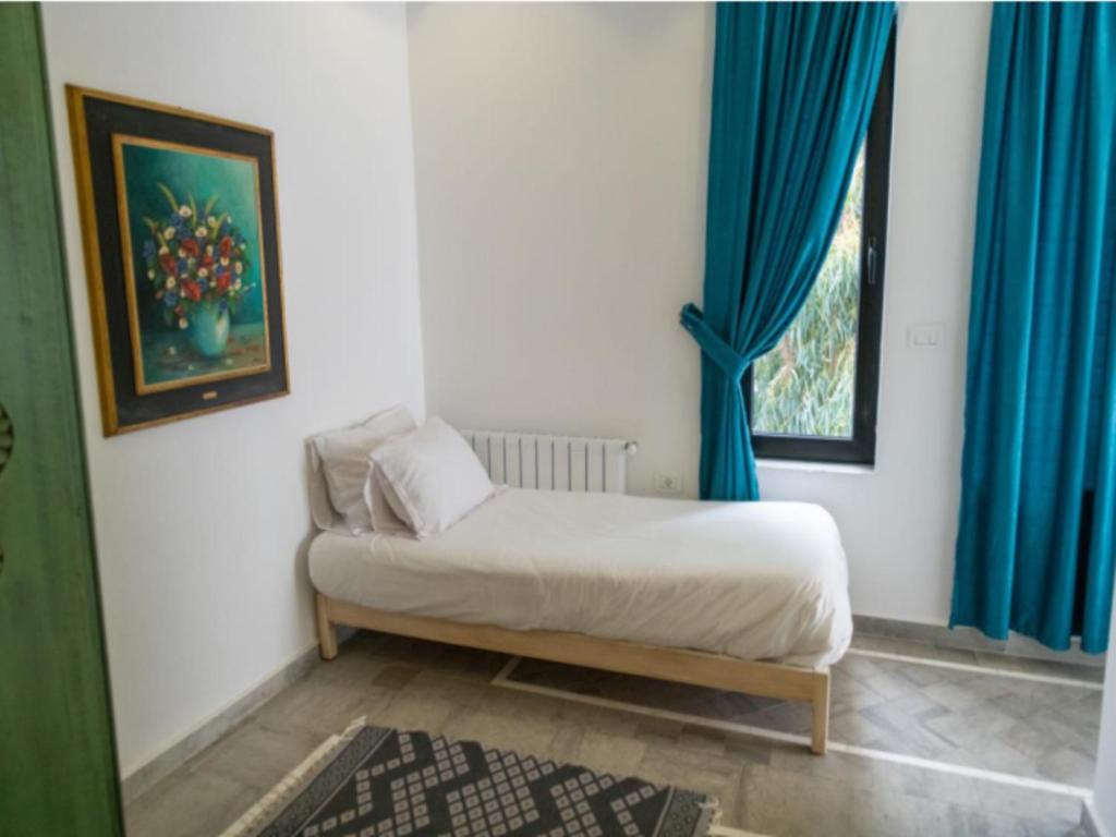 Postel nebo postele na pokoji v ubytování Dar Gino