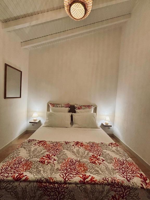Postel nebo postele na pokoji v ubytování Domaine De Grande Terre