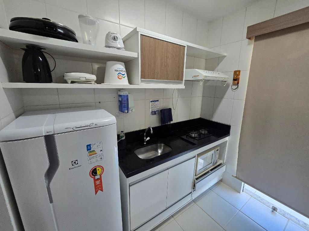 Kuchyň nebo kuchyňský kout v ubytování Apartamentos em Rio Quente com maravilhosa área de lazer e excelente localização