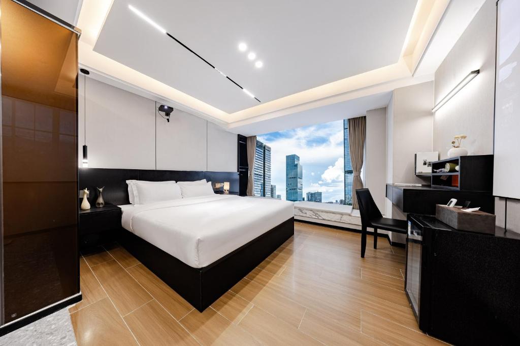 Postel nebo postele na pokoji v ubytování Yu Manju High-floor Huge-Screen Audiovisual Hotel-Guangzhou Tower Zhujiang New Town Sports West Road Branch