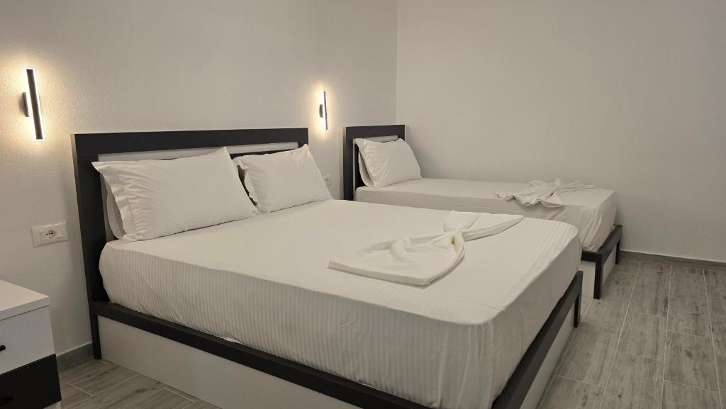 Postel nebo postele na pokoji v ubytování Guest House Pogradeci