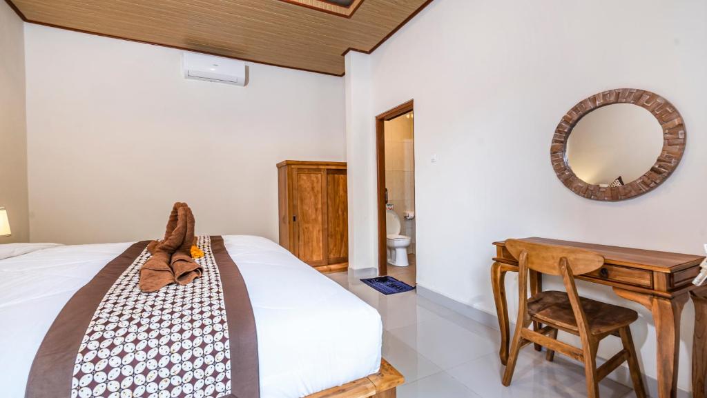 Postel nebo postele na pokoji v ubytování Depi House Ubud
