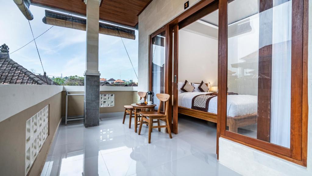 Postel nebo postele na pokoji v ubytování Depi House Ubud