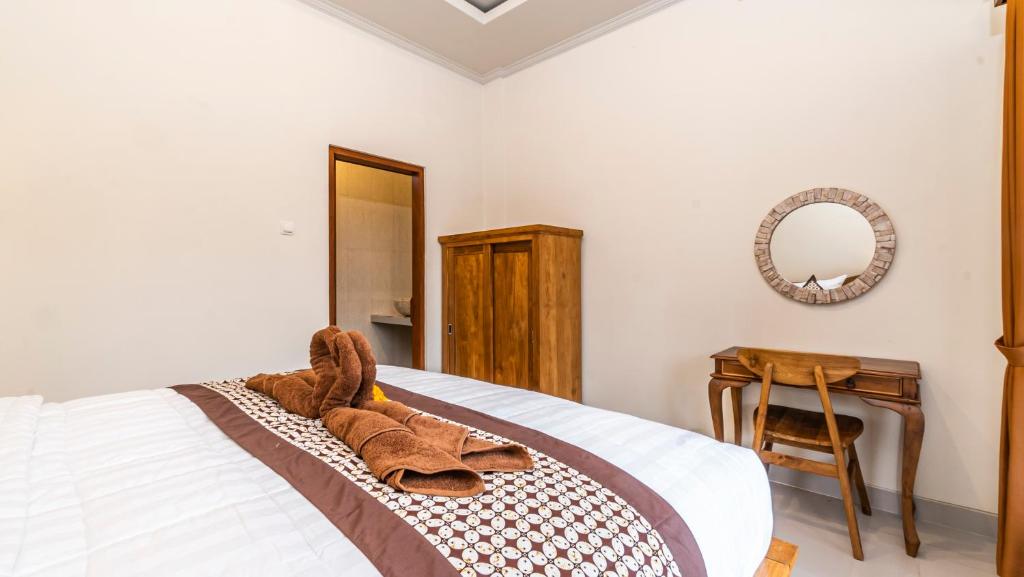 Postel nebo postele na pokoji v ubytování Depi House Ubud