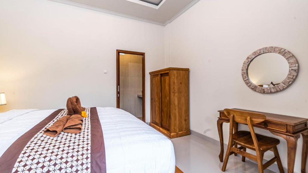 Postel nebo postele na pokoji v ubytování Depi House Ubud