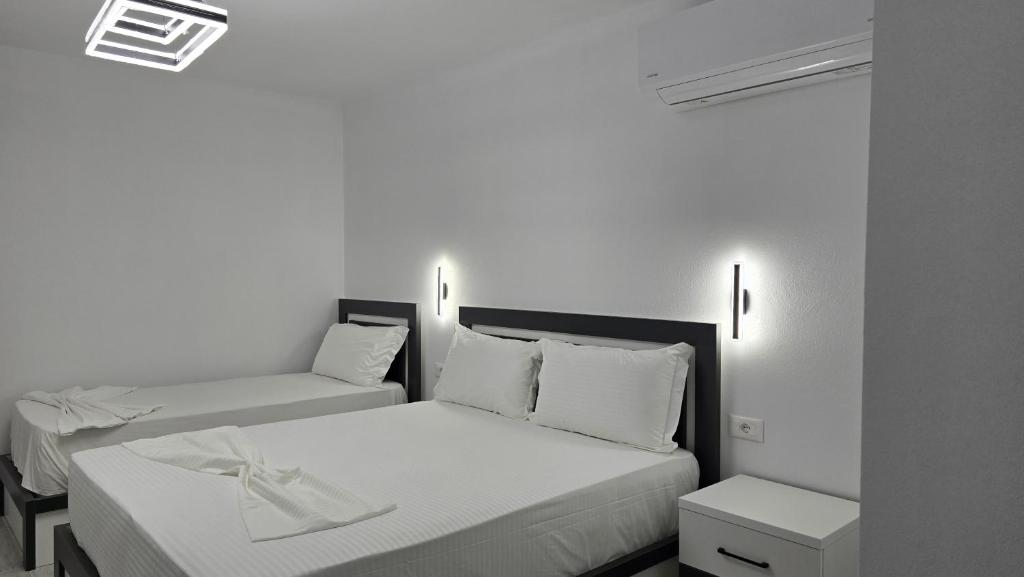 Postel nebo postele na pokoji v ubytování Guest House Pogradeci