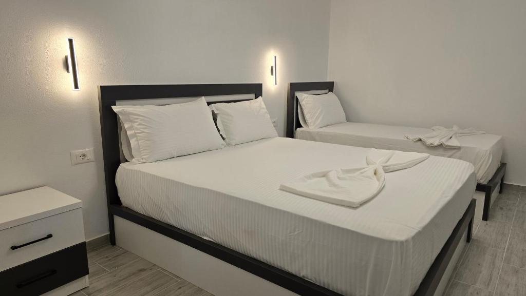 Postel nebo postele na pokoji v ubytování Guest House Pogradeci