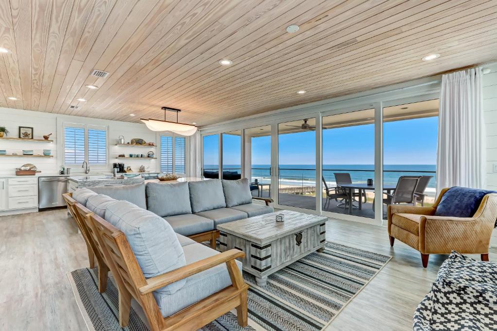 a living room with a couch and a table at 226 South Fletcher Ave home in Fernandina Beach