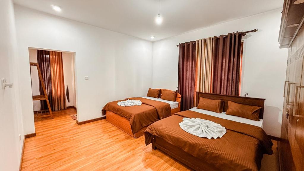 Ένα ή περισσότερα κρεβάτια σε δωμάτιο στο Cloud 16 Homestay