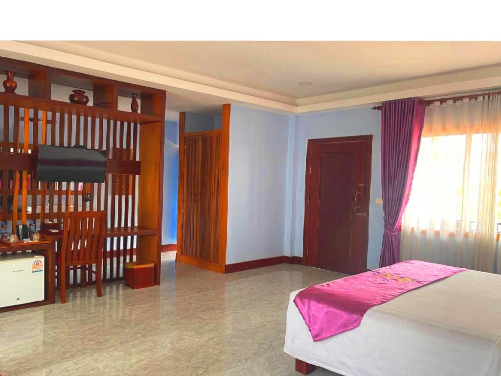 Postel nebo postele na pokoji v ubytování Cheata Residence