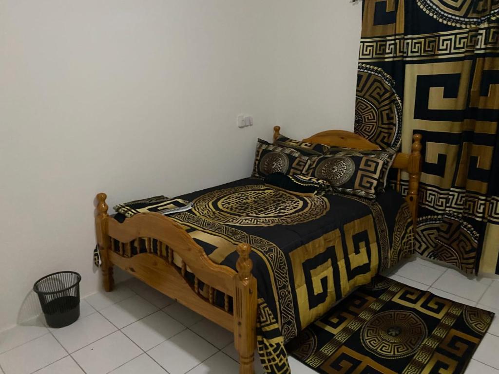 Voodi või voodid majutusasutuse Multiple Holiday Rooms in Port Morant St Thomas Jamaica toas