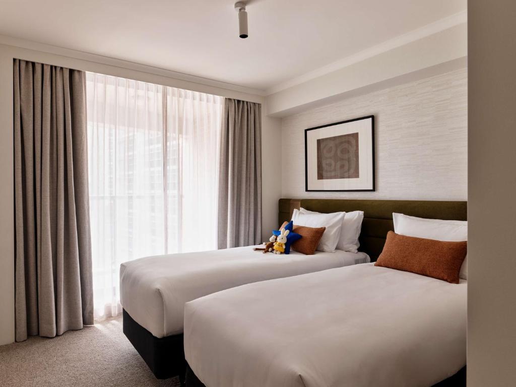 Postel nebo postele na pokoji v ubytování Adina Apartment Hotel Sydney Town Hall