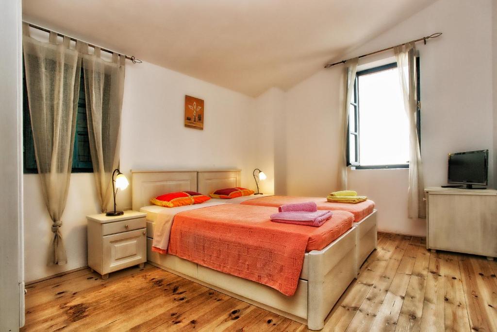 Letto o letti in una camera di B&B Apart Hotel Paštrovski Konak