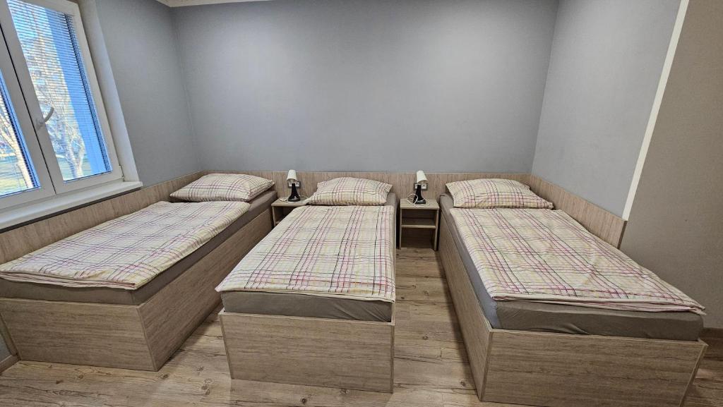 Postel nebo postele na pokoji v ubytování Rezidence Bělehradská