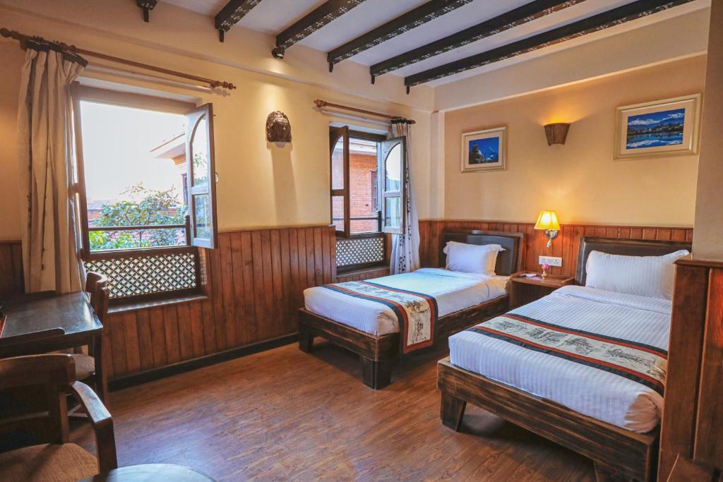 Postel nebo postele na pokoji v ubytování Hotel Yechu