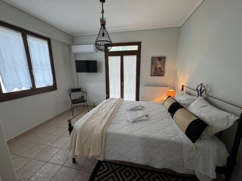 Postel nebo postele na pokoji v ubytování Villa Iris