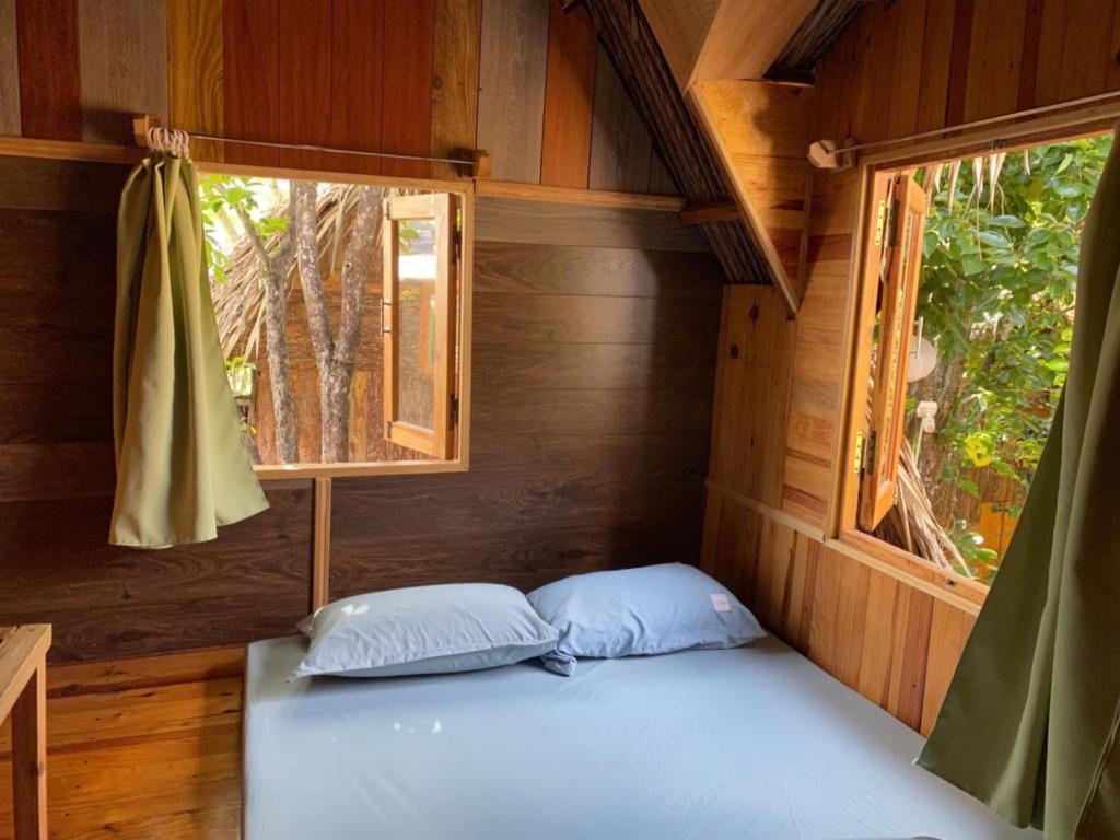 Postel nebo postele na pokoji v ubytování Đà Lạt Củi Homestay