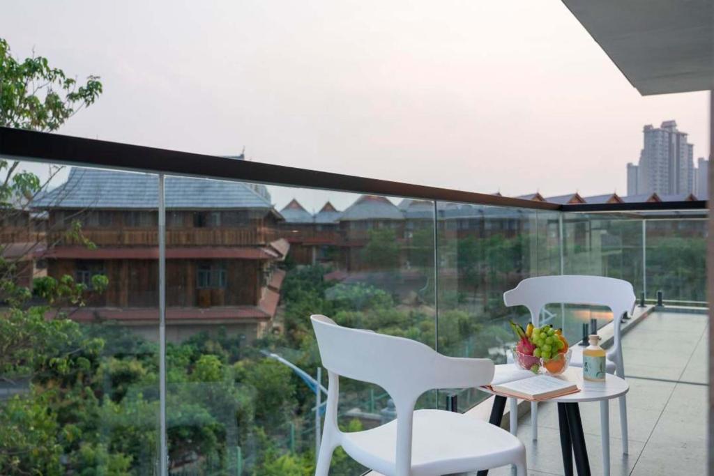 Balkón nebo terasa v ubytování Xishuangbanna Verdant House Resort Hotel