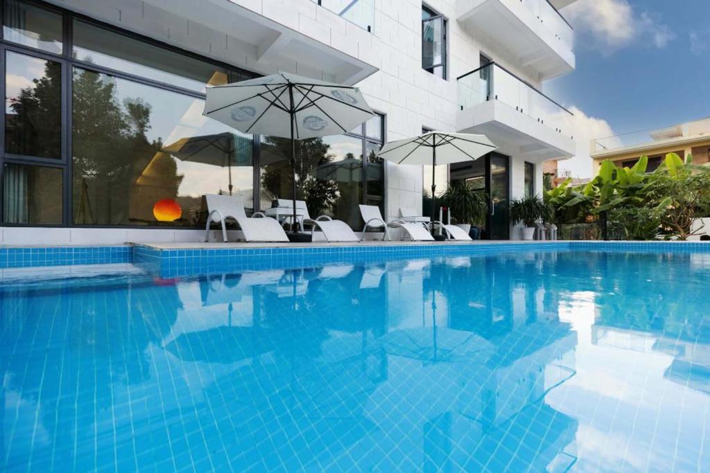 Bazén v ubytování Xishuangbanna Verdant House Resort Hotel nebo v jeho okolí