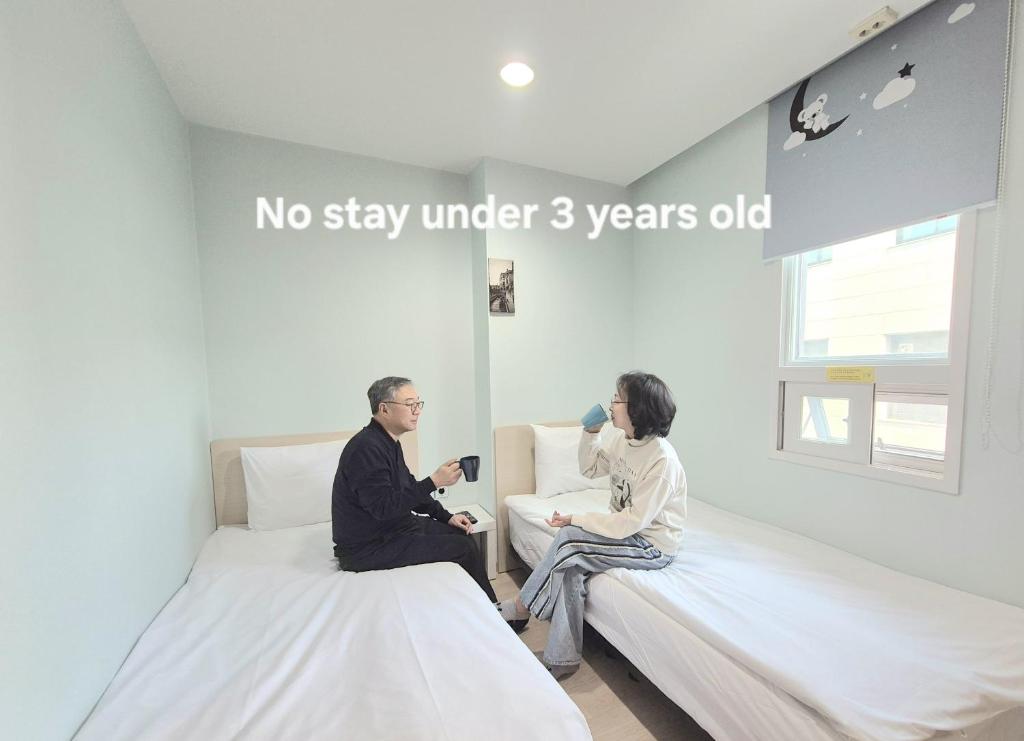 Cama ou camas em um quarto em Hostel Tommy Renewal 2025