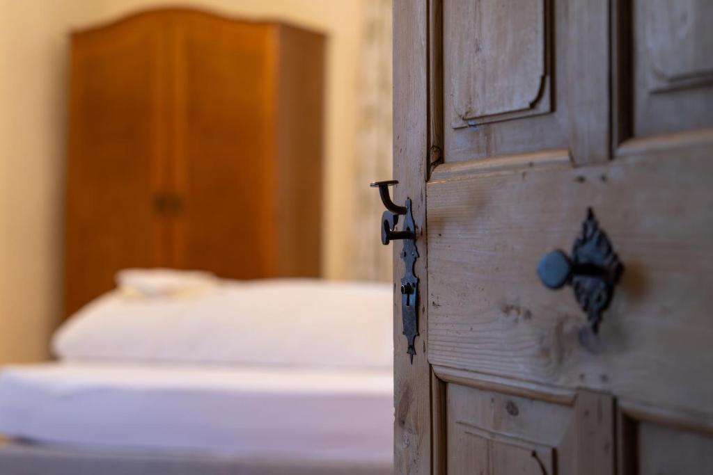 Postel nebo postele na pokoji v ubytování Gästehaus Goldener Stern