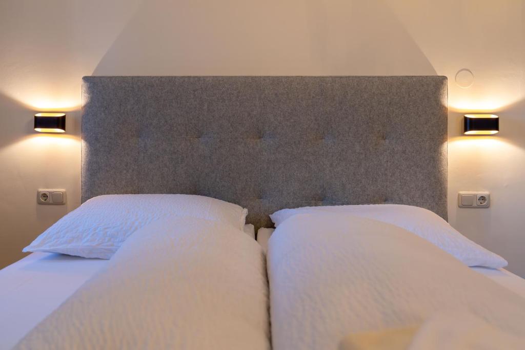 Postel nebo postele na pokoji v ubytování Gästehaus Goldener Stern