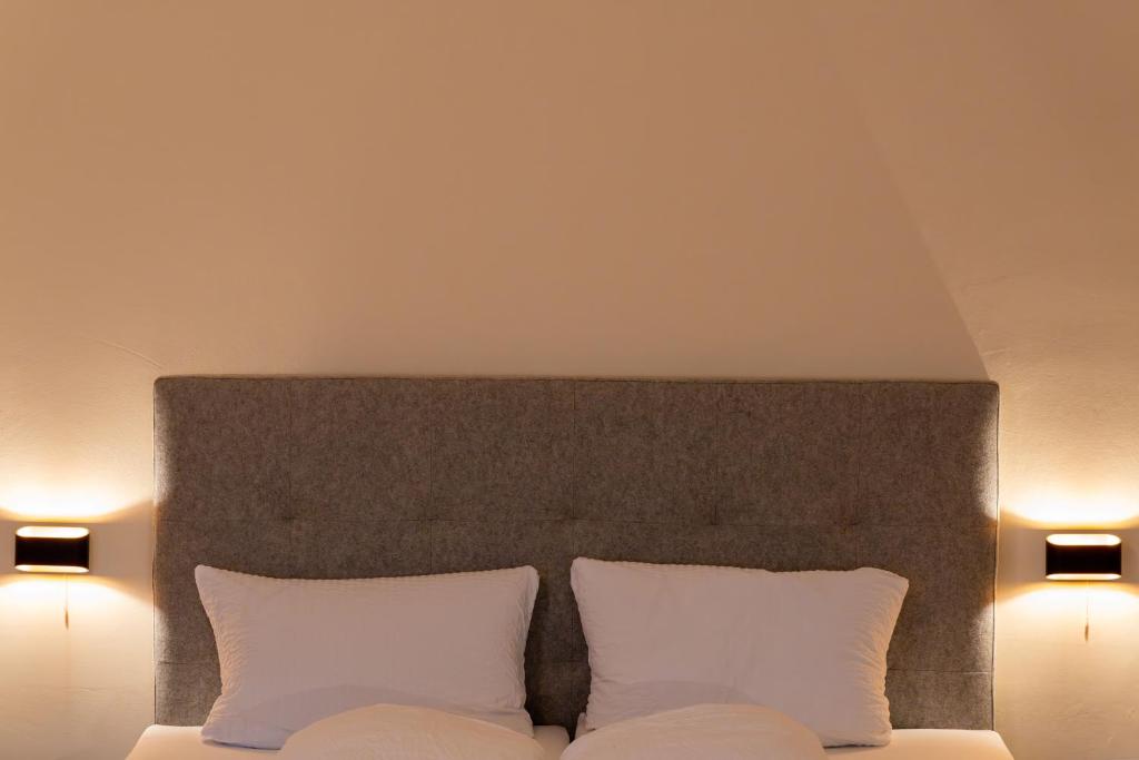Postel nebo postele na pokoji v ubytování Gästehaus Goldener Stern
