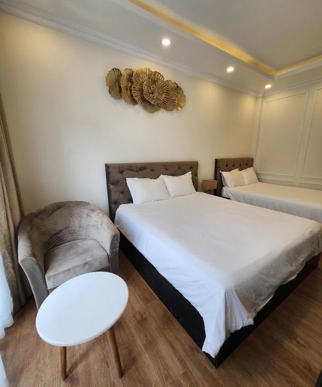 Postel nebo postele na pokoji v ubytování BREAKING DAWN- TAEYANG Hotel Phú Quốc