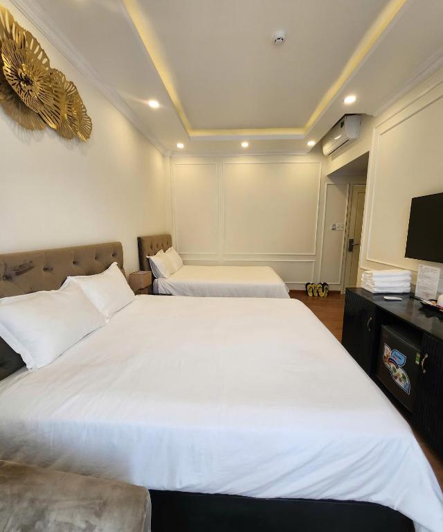 Postel nebo postele na pokoji v ubytování BREAKING DAWN- TAEYANG Hotel Phú Quốc