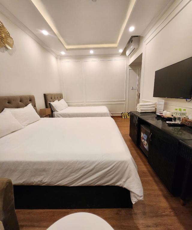 Postel nebo postele na pokoji v ubytování BREAKING DAWN- TAEYANG Hotel Phú Quốc